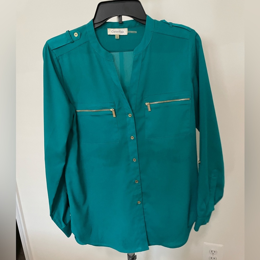 Teal Calvin Klein blouse.